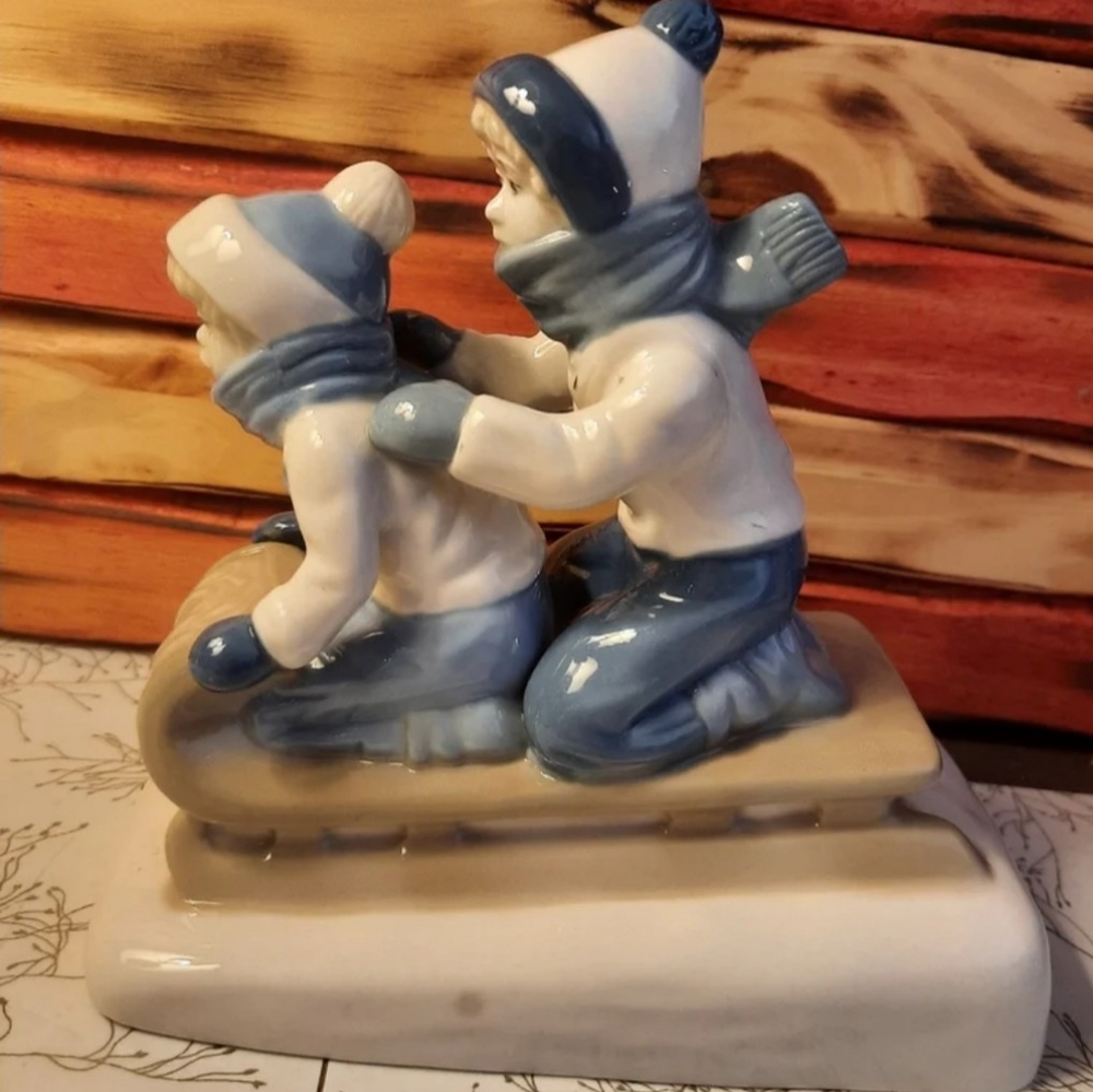 Vtg porcelain kids sledding figurine snow Paul Sebastian